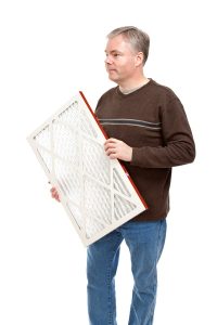 person-with-an-HVAC-air-filter